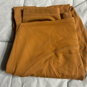 Instill high rise tight 25” size 12 in color camel/brown color.